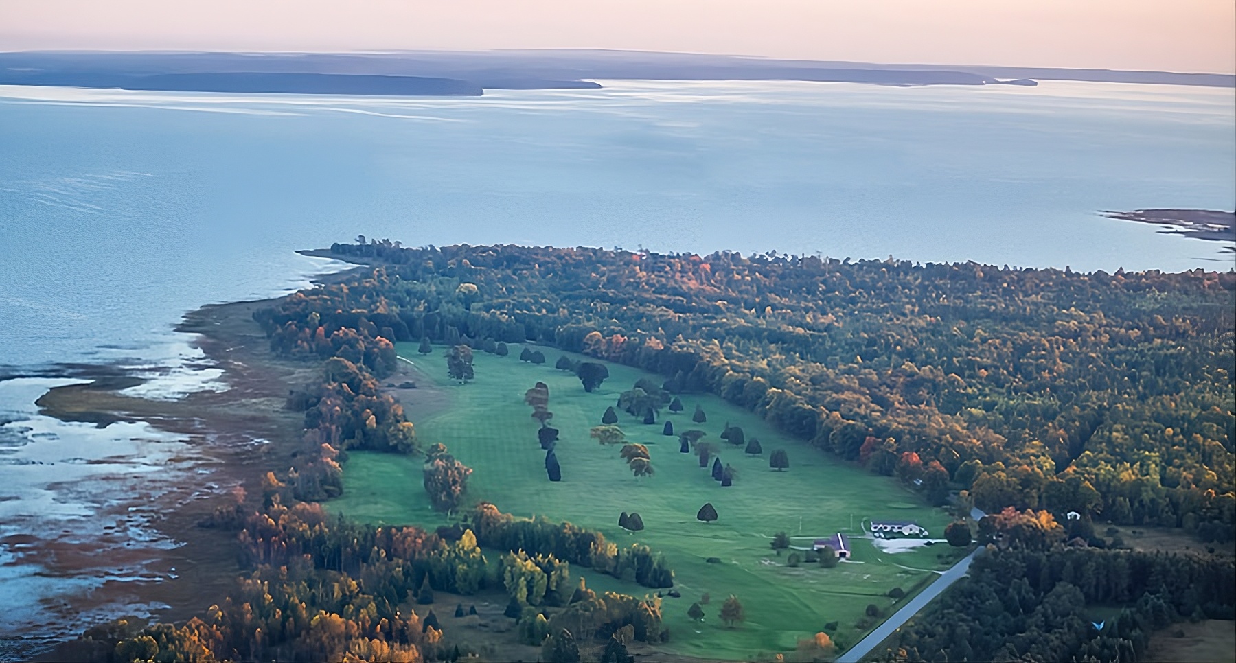 Aerial view of Big Bay de Noc from above Nahma Golf Club — the scale of the bay golfers from Manistique, MI arrive at after the 23-mile drive west on US-2