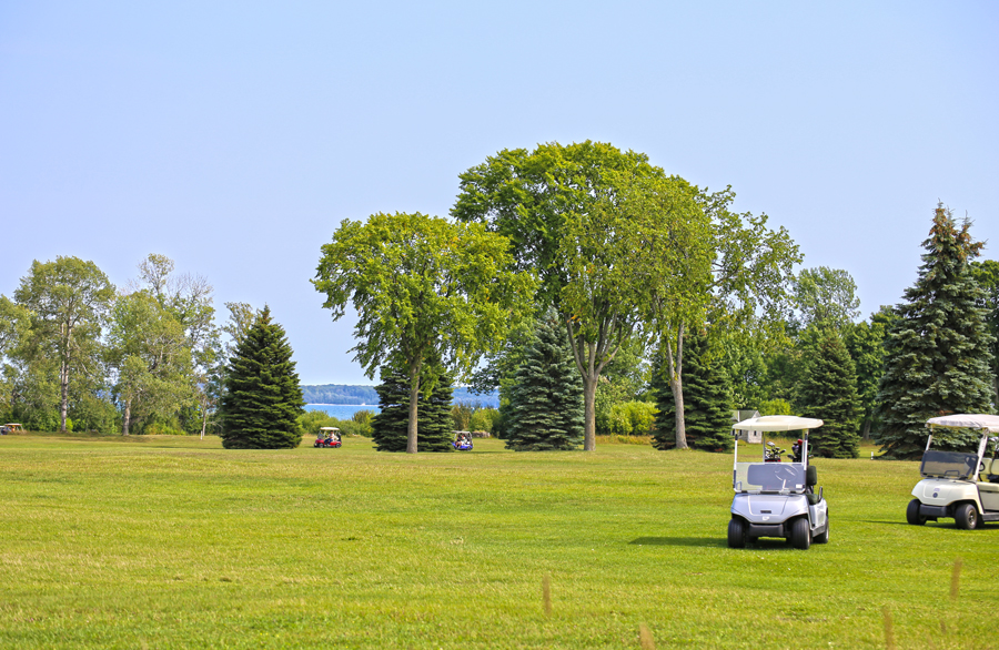 Hole 3 dogleg fairway at Nahma Golf Club.